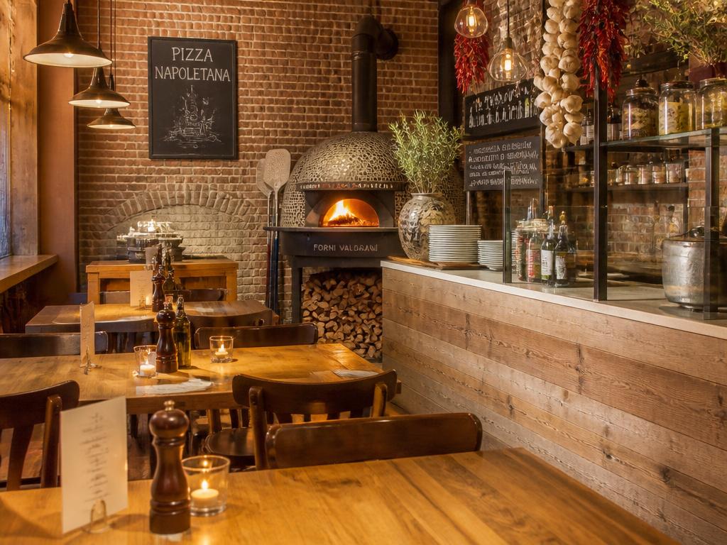 Cozy interior of Harvest Pizza with a wood-fired oven